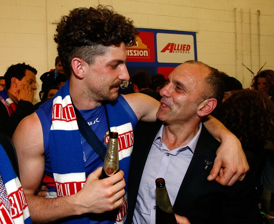 AFL 2016 Toyota AFL Grand Final - Sydney v Western Bulldogs MELBOURNE, AUSTRALIA - OCTOBER 01: Tom Liberatore of the Bulldogs shares a beer with his dad Tony Liberatore during the 2016 Toyota AFL Grand Final match between the Sydney Swans and the Western Bulldogs at the Melbourne Cricket Ground on October 01, 2016 in Melbourne, Australia. (Photo by Adam Trafford/AFL Media)